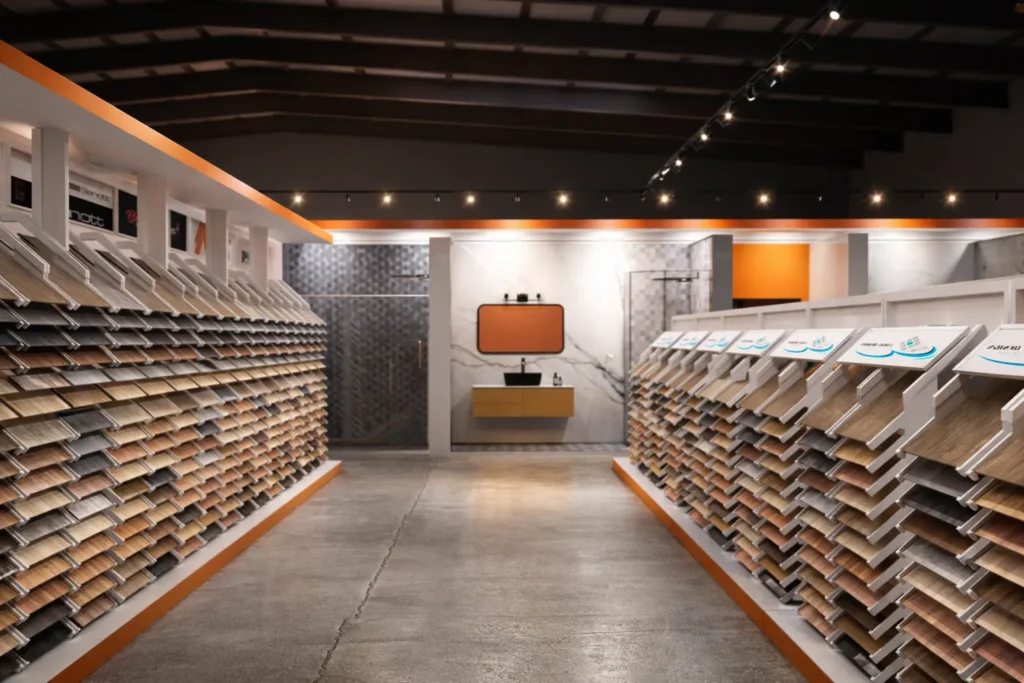 Modern luxury tile showroom interior design services with organized tile sample display racks and ambient lighting