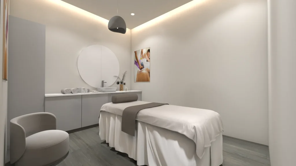 Modern spa treatment room featuring massage bed and soft ambient lighting.