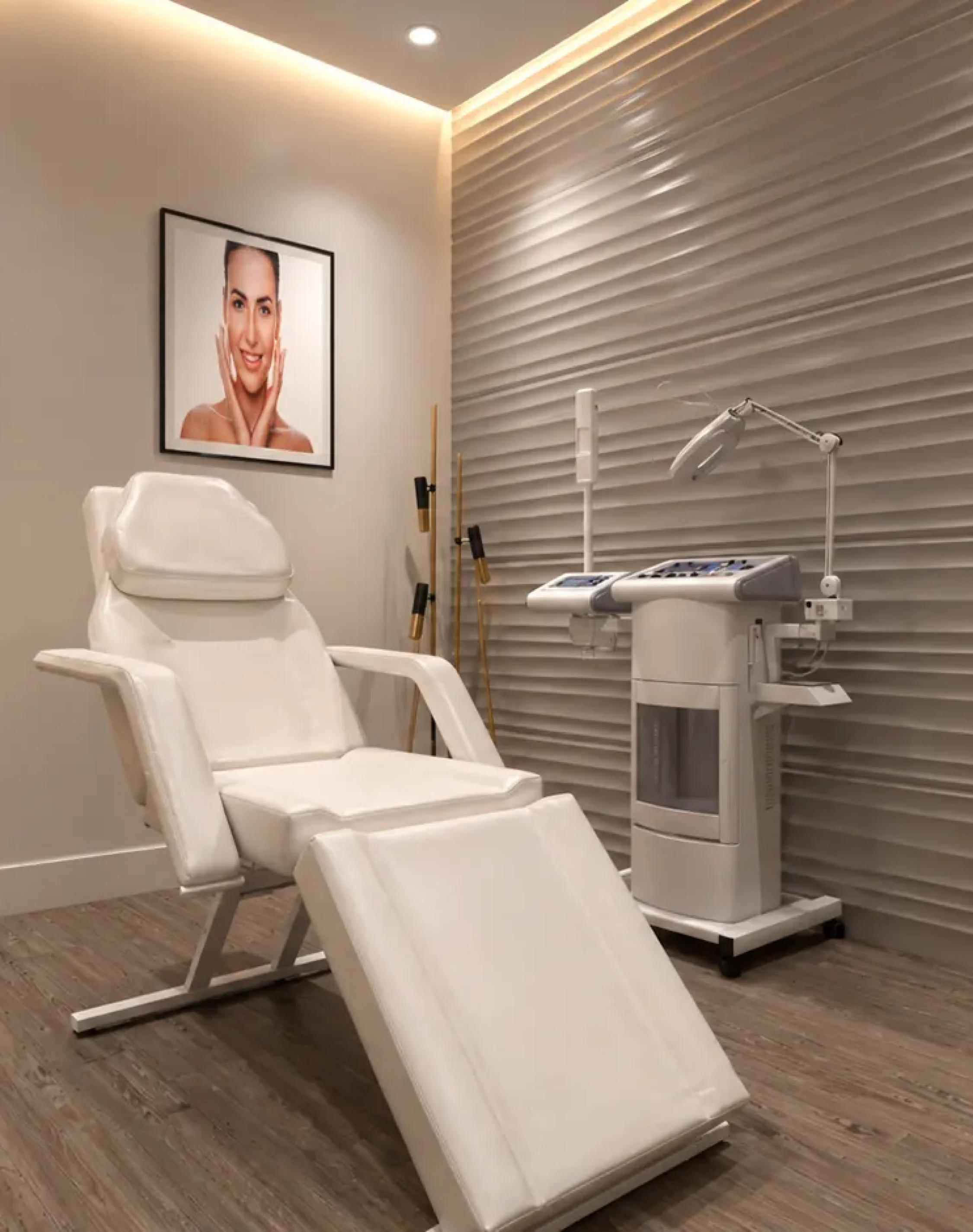 Professional skincare treatment room with medical aesthetic equipment and modern interior design.