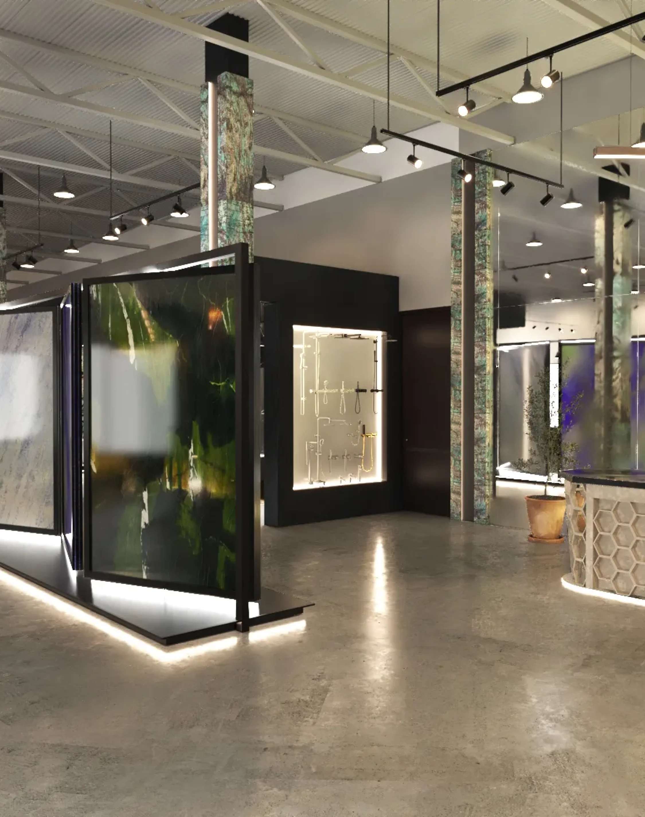 Premium marble display area with large illuminated stone panels and modern showroom lighting.