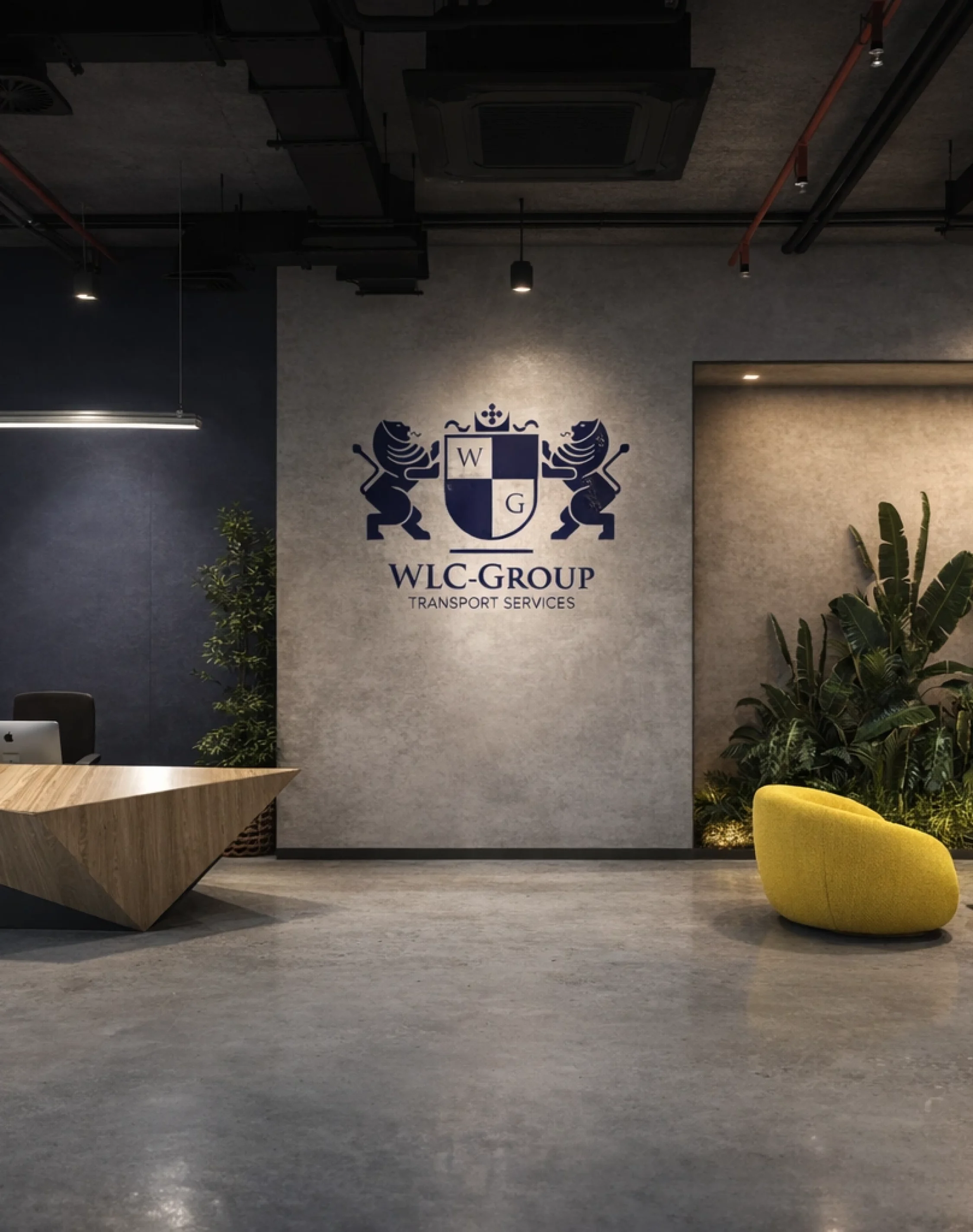 Modern commercial reception area with luxury marble desk, elegant chandelier lighting.