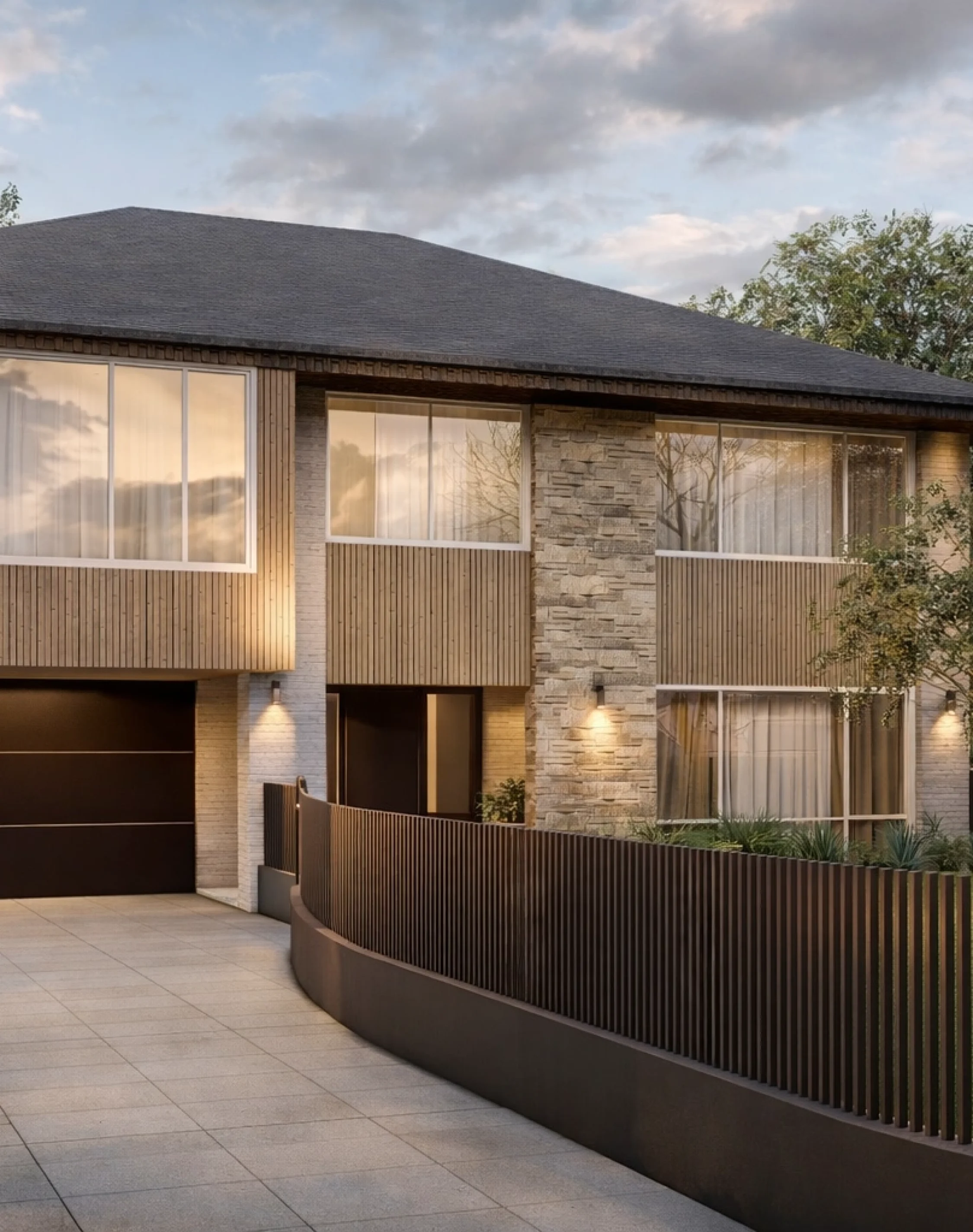 Contemporary family home exterior with wood cladding, stone feature wall, and modern driveway design in Australia.