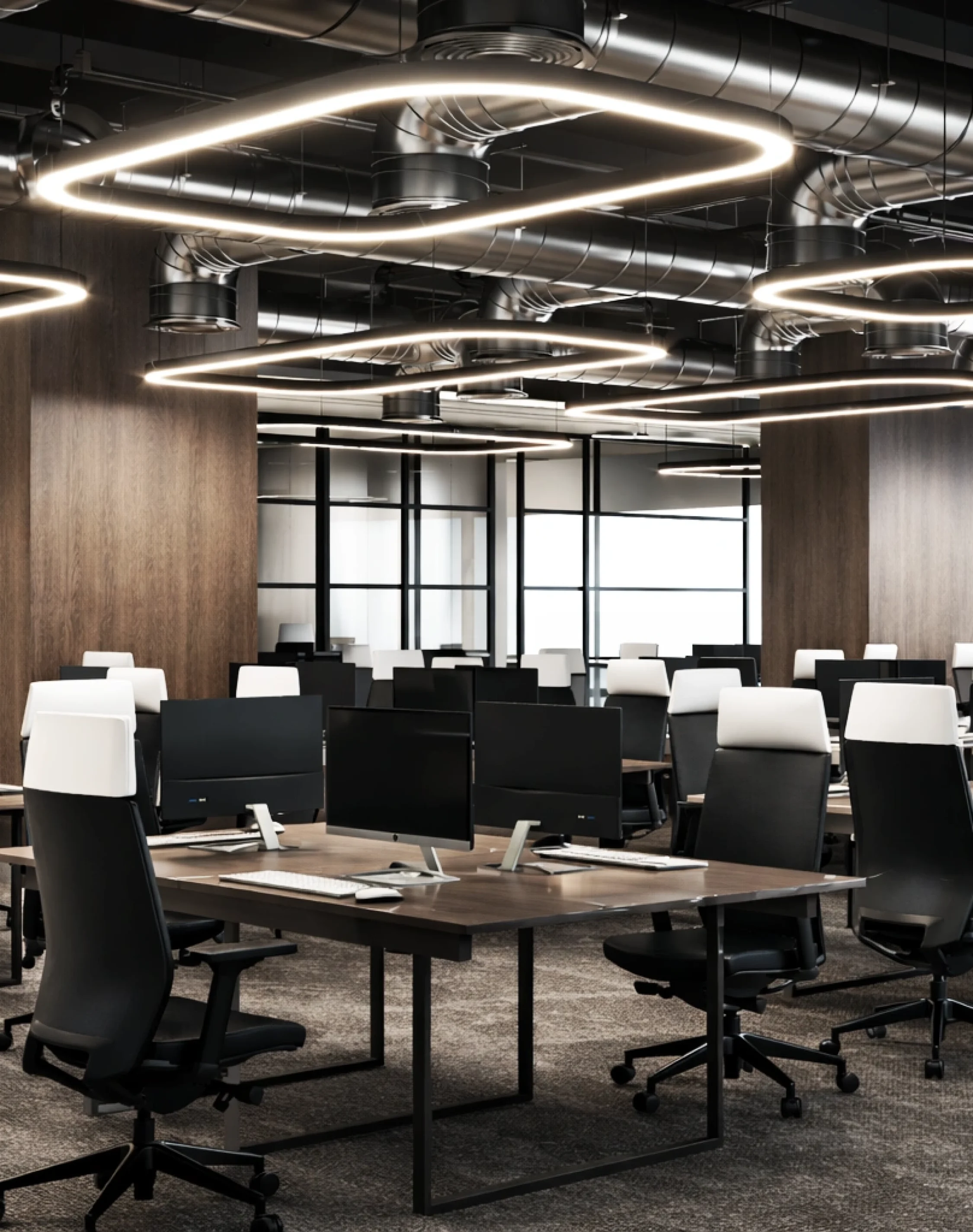 Contemporary open office workspace with modern desks, geometric lighting, and professional commercial interior design.